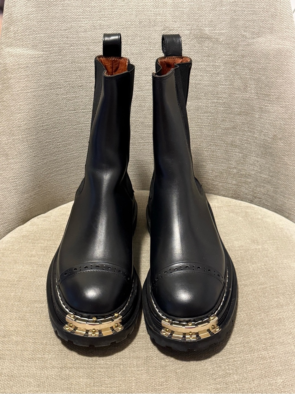 Black Leather Chelsea Booties with Gold Toe Accents